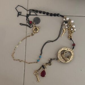 Disney Couture Gold and Black Pirates of the Caribbean necklace